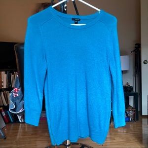Turquoise sweater with gold side zippers
